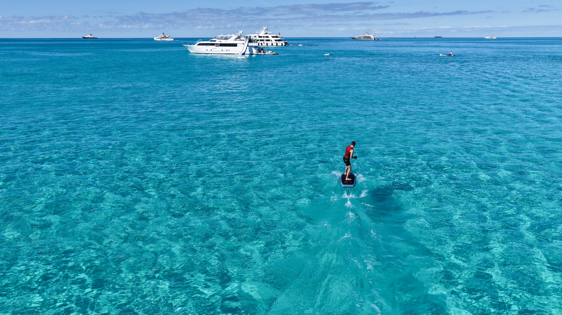 Guest e-foiling over clear Bahamas water